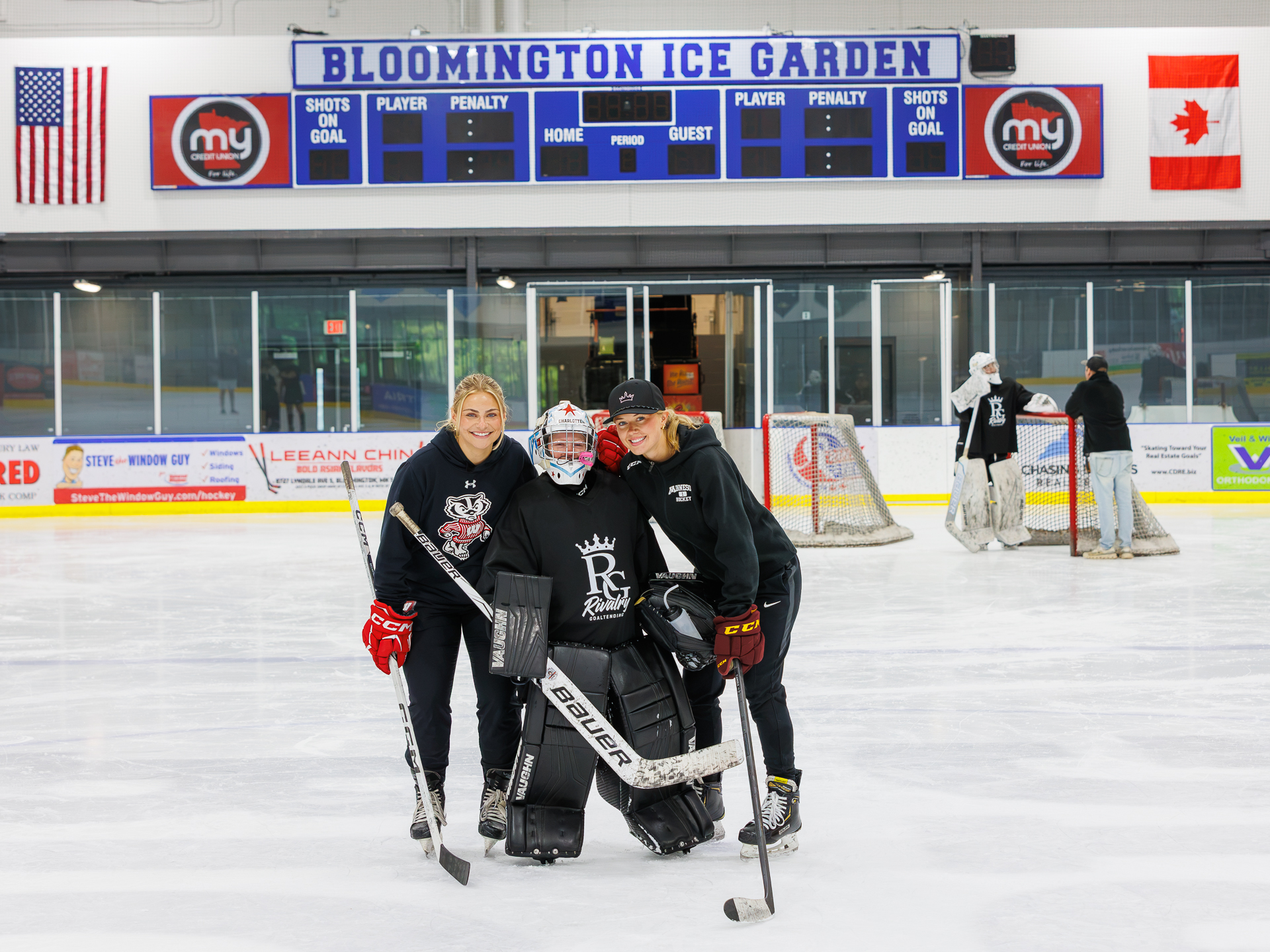 Coaches and goalie posing after a training session